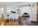 Open floor plan: living space transitions to dining and kitchen areas with hardwood floors, plus front door access at 3355 Talisman Ct # C, Boulder, CO 80301