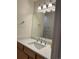 Bathroom vanity featuring a sink with chrome fixtures and a large mirror at 1833 N Williams St # 507, Denver, CO 80218