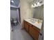 Bathroom featuring a vanity with storage and a shower with a curtain at 1833 N Williams St # 507, Denver, CO 80218