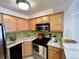 Cozy kitchen featuring ample natural light and stainless steel appliances at 1833 N Williams St # 507, Denver, CO 80218