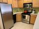 Kitchen featuring stainless steel appliances and updated countertops at 1833 N Williams St # 507, Denver, CO 80218