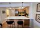 Well-organized kitchen featuring a breakfast bar and stainless steel appliances at 1833 N Williams St # 507, Denver, CO 80218