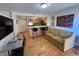 Open-concept space with kitchen, breakfast bar and comfortable couch seating at 1833 N Williams St # 507, Denver, CO 80218