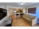 Open-concept living space featuring kitchen, breakfast bar and comfortable seating at 1833 N Williams St # 507, Denver, CO 80218