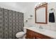 Clean bathroom with shower/tub and wood vanity at 6922 Vance St, Arvada, CO 80003