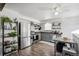 Modern kitchen with stainless steel appliances and wood flooring at 6922 Vance St, Arvada, CO 80003