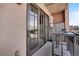 Condo balcony features sliding glass doors and space for seating at 410 Acoma St # 515, Denver, CO 80204