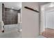 Cozy bathroom with a tiled shower and tub combination featuring hardwood floors and a white sink at 410 Acoma St # 515, Denver, CO 80204