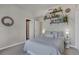 Comfortable bedroom featuring a cozy bed, shelves containing plant life, and a doorway at 410 Acoma St # 515, Denver, CO 80204