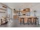 Spacious kitchen with a bar, stainless steel appliances and a door to the balcony at 410 Acoma St # 515, Denver, CO 80204
