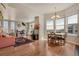 Open-concept living room and dining area with hardwood floors and abundant natural light at 410 Acoma St # 515, Denver, CO 80204