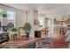 Spacious living area with hardwood floors flowing into an open concept dining and kitchen area at 410 Acoma St # 515, Denver, CO 80204