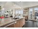 Bright open-concept living space featuring a kitchen island, dining area, and living room, ideal for entertaining at 410 Acoma St # 515, Denver, CO 80204