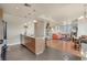 An open living space with modern kitchen island, adjacent dining area and living room at 410 Acoma St # 515, Denver, CO 80204