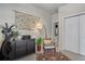 Comfortable office space featuring a stylish rug, modern chair, and plenty of plant life at 410 Acoma St # 515, Denver, CO 80204