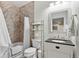 Well-appointed bathroom with a tiled shower-tub combo, contemporary vanity, and ample storage space at 6725 Beech Ct, Arvada, CO 80004