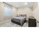 Tranquil bedroom with soft lighting, featuring a comfortable bed, subtle decor, and a calming atmosphere at 6725 Beech Ct, Arvada, CO 80004