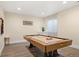 Entertainment room with a classic billiards table, ideal for recreation and relaxation at 6725 Beech Ct, Arvada, CO 80004