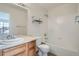 Bathroom features a tub/shower and oak cabinets with solid surface counters at 19213 E Idaho Dr # 105, Aurora, CO 80017
