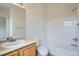 Bright bathroom with a shower and bathtub combination and a single sink vanity at 19213 E Idaho Dr # 105, Aurora, CO 80017