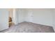 Bedroom with neutral carpet, double closets, and an ensuite bathroom with oak vanity at 19213 E Idaho Dr # 105, Aurora, CO 80017