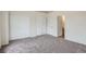 Bright bedroom with double closets and an ensuite bathroom with wood cabinets at 19213 E Idaho Dr # 105, Aurora, CO 80017