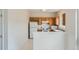 Clean kitchen features white appliances and wood cabinets offering ample storage and functionality at 19213 E Idaho Dr # 105, Aurora, CO 80017