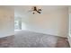 Bright living room featuring new carpet and sliding glass doors leading to outdoor area at 19213 E Idaho Dr # 105, Aurora, CO 80017