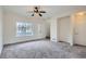 Bright living room with large window and a ceiling fan creating a cozy and inviting atmosphere at 19213 E Idaho Dr # 105, Aurora, CO 80017