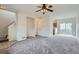 Comfortable living room leading into an open kitchen area, creating an inclusive living space at 19213 E Idaho Dr # 105, Aurora, CO 80017