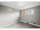 Gray-walled bedroom with wood-look floors and window at 3343 W Hialeah Ave, Littleton, CO 80123