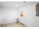 Bright laundry room with exterior access and built-in shelving at 3343 W Hialeah Ave, Littleton, CO 80123