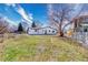 Large backyard with a chain link fence and frame for a shed or outdoor structure at 6882 Quail St, Arvada, CO 80004