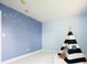 Cute bedroom with teepee tent, soft carpet, and whimsical space decorations at 11131 W Oregon Pl, Lakewood, CO 80232