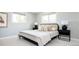 Cozy bedroom with neutral tones, large windows, and stylish furnishings at 11131 W Oregon Pl, Lakewood, CO 80232