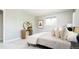 Comfortable bedroom featuring soft carpet, stylish decor and natural light at 11131 W Oregon Pl, Lakewood, CO 80232