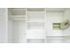 Well-organized closet with built-in shelves, drawers, rod, and a safe at 11131 W Oregon Pl, Lakewood, CO 80232