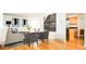 Open living room with hardwood floors, neutral color scheme, and modern furniture that add to the inviting space at 11131 W Oregon Pl, Lakewood, CO 80232
