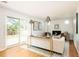Bright living room with hardwood floors, neutral décor, and sliding glass doors to the outdoors at 11131 W Oregon Pl, Lakewood, CO 80232