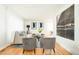 Bright and airy living room featuring hardwood floors, modern decor, neutral tones, and a comfortable seating arrangement at 11131 W Oregon Pl, Lakewood, CO 80232
