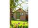 Charming storage shed with green trim, a green door, and well-maintained landscaping in a lovely backyard setting at 11131 W Oregon Pl, Lakewood, CO 80232