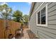 Side yard with garden area, a charming fence and easy access via the side door from the house at 11031 Marshall St, Westminster, CO 80020