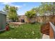 Spacious backyard featuring a stone patio, grassy area and garden, perfect for relaxing and entertaining at 11031 Marshall St, Westminster, CO 80020