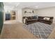 Basement area with plush L-shaped couch, carpeted floors, and unique decor at 11031 Marshall St, Westminster, CO 80020