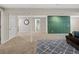 Open basement area with plush seating, unique design elements, and carpeted floors at 11031 Marshall St, Westminster, CO 80020