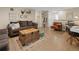 Cozy basement living area with stylish decor, including a trunk coffee table and comfortable seating at 11031 Marshall St, Westminster, CO 80020