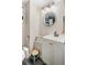 Updated bathroom featuring modern fixtures, a white vanity, and contemporary accents at 11031 Marshall St, Westminster, CO 80020