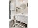 Cozy bathroom featuring a white vanity with storage, a toilet and decoratively organized items at 11031 Marshall St, Westminster, CO 80020