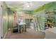 Lively bedroom with green walls, unique leaf decorations and bunk beds with a desk beneath at 11031 Marshall St, Westminster, CO 80020