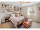 Relaxing bedroom with a bed, decorative artwork on the wall, and a window letting in lots of natural light at 11031 Marshall St, Westminster, CO 80020